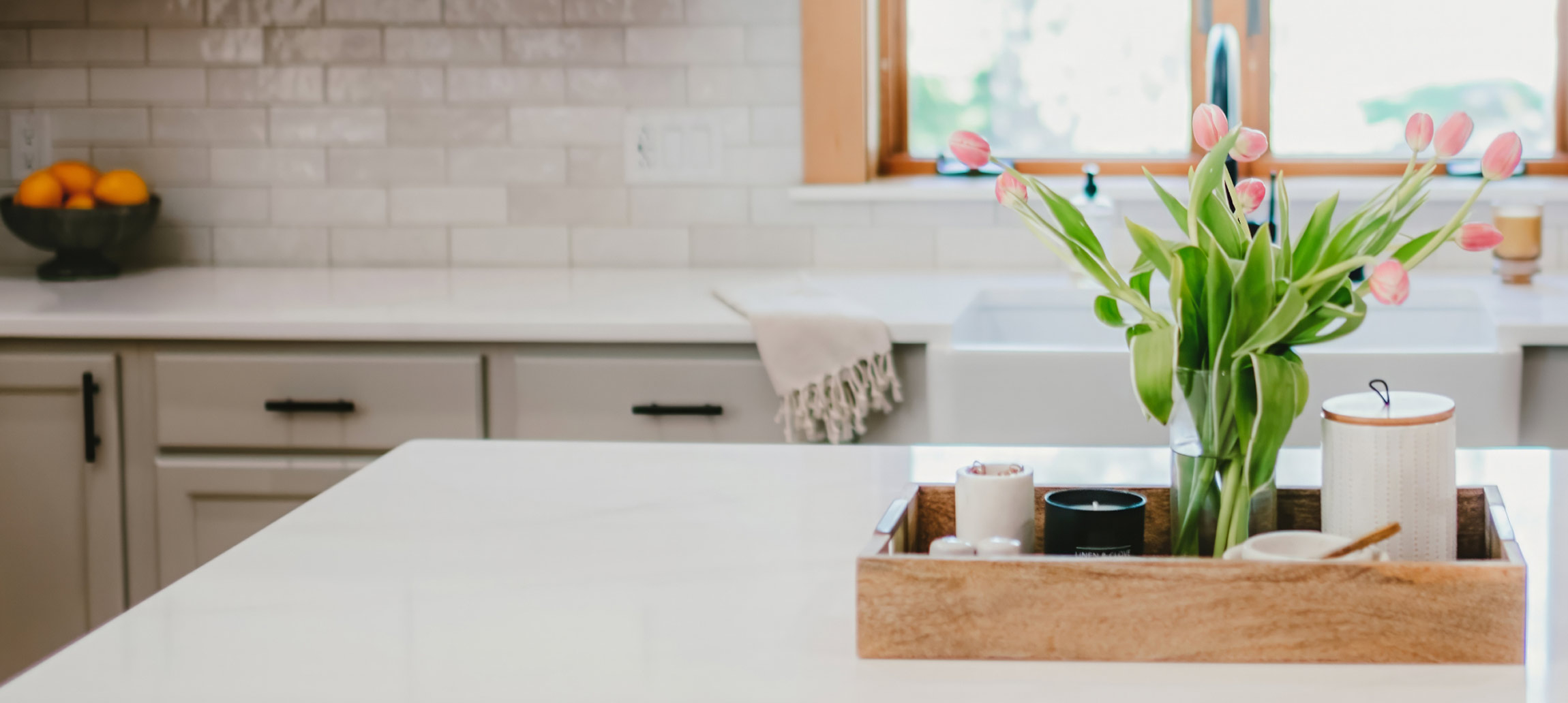A decorative center piece on a white countertop