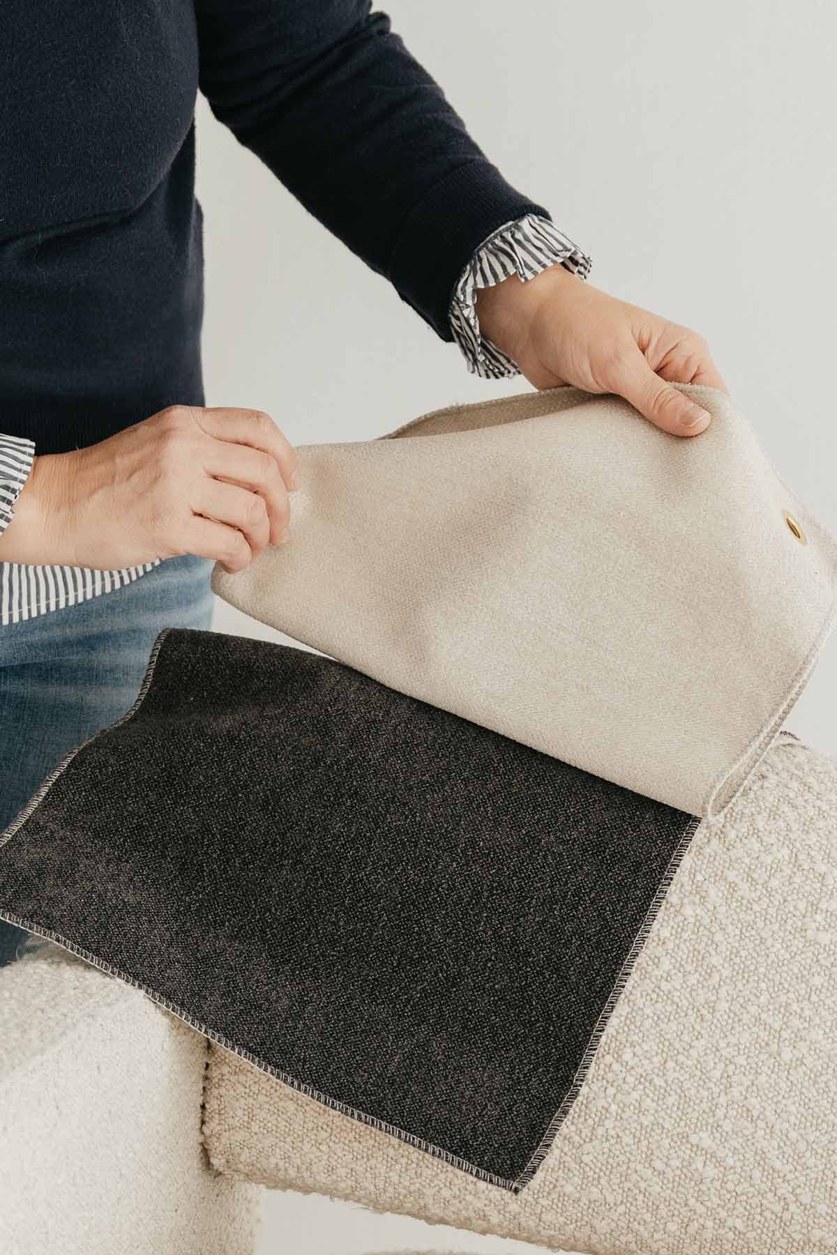 A woman look through color swatches