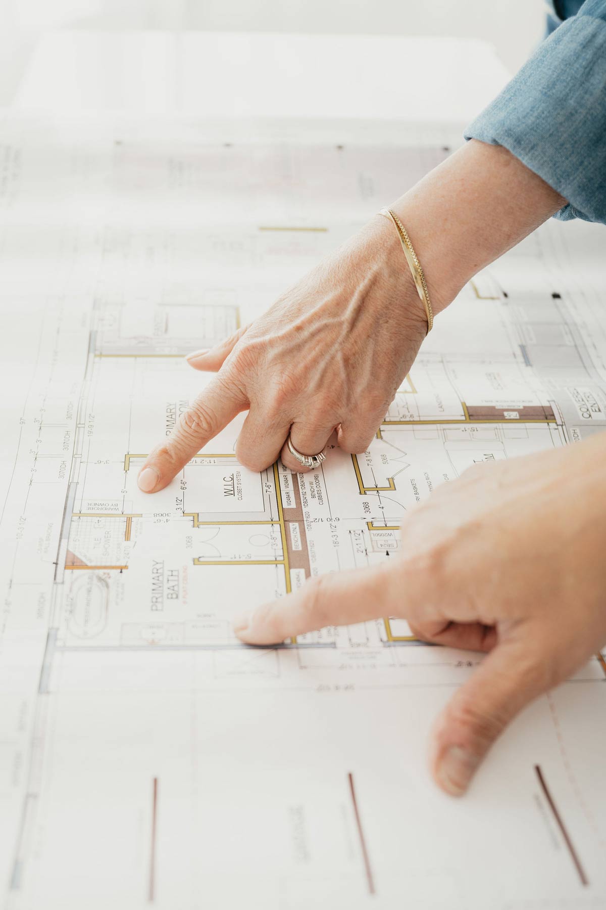 Designers looking at building blueprints